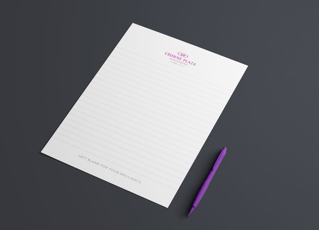 TM Print - Crowne Plaza Hotel notepad sheet with a purple pen